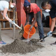 People mixing concrete