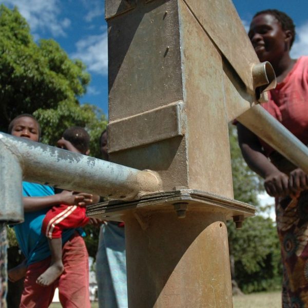 People at water pump