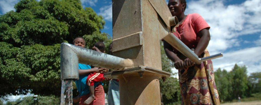 People at water pump